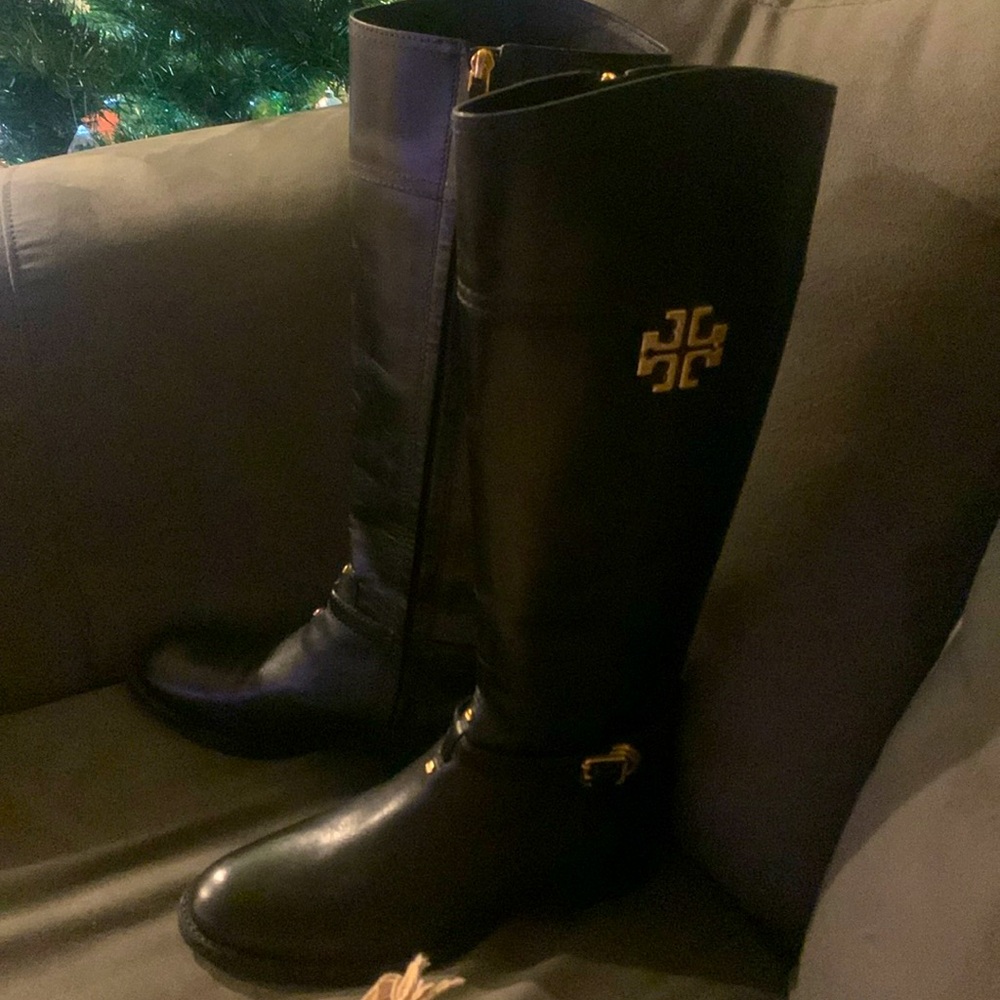 Tory Burch boots never used. New. Includes dust bags without box. Black leather